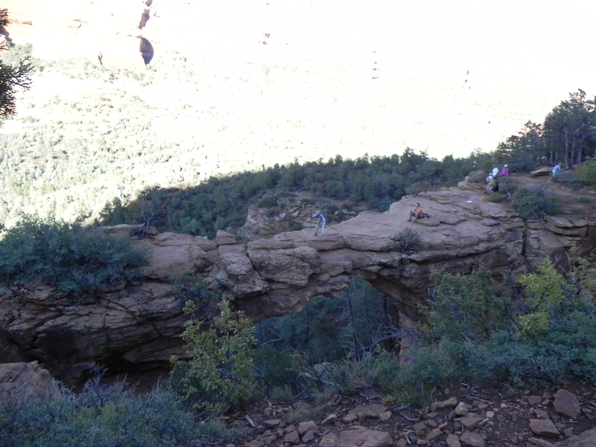 During our last trip to Sedona, we wanted to go for a hike to see Devil's Bridge.  This is a natural land bridge that hovers over the edge of a canyon with over a 100 foot drop.  The hike to get to Devil's Bridge is moderately strenuous and the final climb to the Bridge being accessed by natural rock steps that can be tough to navigate by those who are not in shape or have bad knees etc.  But if you are able to make it to the top and walk out to view the bridge it is WELL WORTH the effort.    Once you see this amazing natural land bridge your next thought is to hike over to it and walk out onto it.  This part is not for the feint of heart and there is no protection from the edge and the bridge gets thin towards the center.  But like clockwork people were hiking out there, standing for pictures and one girl was going to do a hand stand or some sort of yoga move while her friend took a picture.    This is a great hike and well worth the effort.  Devil's Bridge parking is off Long Canyon Rd but there is also a forest service rd that cars were using but I would recommend a truck just because some cars were barely making it. It is certainly much less of a hike by using the forest road so to each their own.  I highly recommend Devil's Bridge in Sedona.